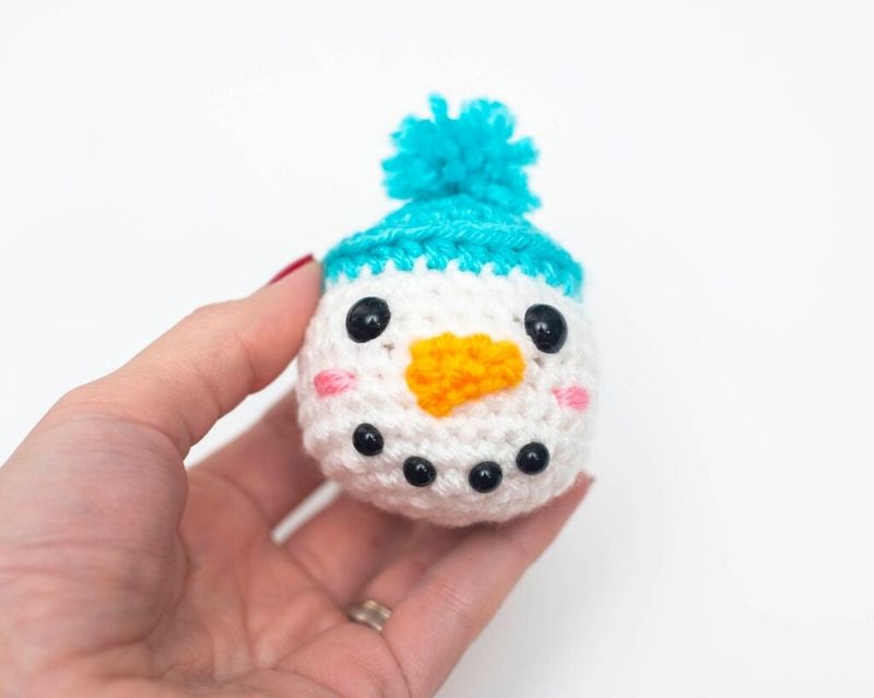 Tiny Snowman free crochet pattern by Nicole Chase